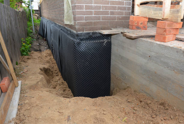 SJ Waterproofing Pros technician performing targeted Emergency Waterproofing assessment in Hamersville, OH